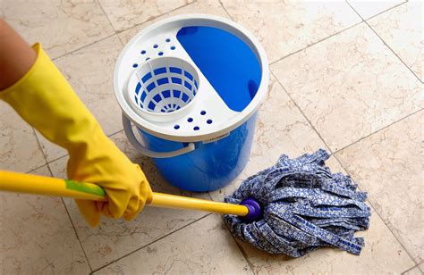 How to clean floor tiles - Lightly dampen a microfiber mop and always clean following the grain of the wood and allow the wood to dry completely before walking to prevent spotting. If you live in an area with hard water, damp mop with distilled water. The excessive minerals in hard water can leave the floor finishes looking dull.
